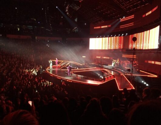 The Jonas Brothers performing in an arena