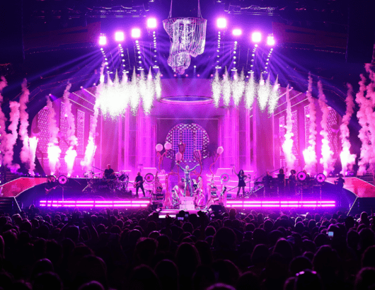 Pop singer P!NK on stage with dancers, band, and smoke machines